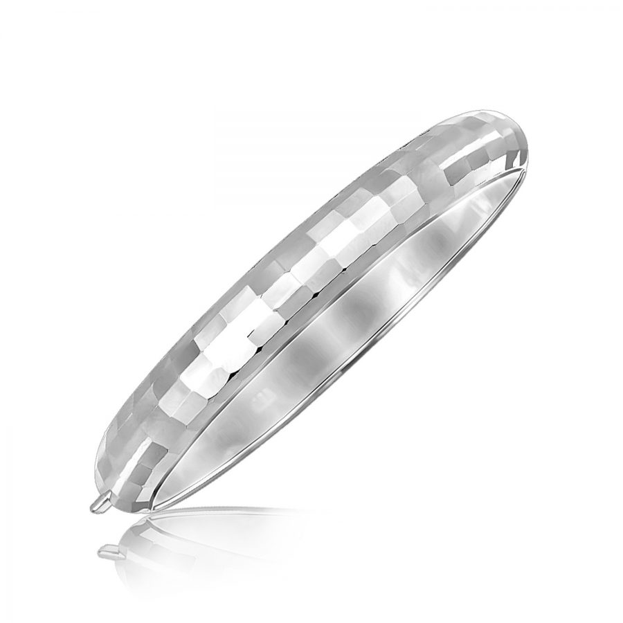 Sterling Silver Rhodium Plated Bangle with a Fancy Diamond Cut Faceted Motif