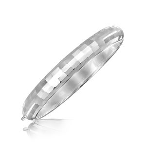 Sterling Silver Rhodium Plated Bangle with a Fancy Diamond Cut Faceted Motif